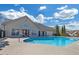 Community pool with lounge chairs and a clubhouse at 402 Silver Summit Se Dr, Conyers, GA 30094