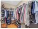 A well-organized walk-in closet with shelving, hanging space and shoe racks at 402 Silver Summit Se Dr, Conyers, GA 30094