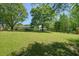 Large backyard with mature trees, providing plenty of shade and privacy at 1214 Marshall Fuller Rd, Dallas, GA 30157
