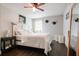 Bright bedroom with wood floors, a ceiling fan, a bed and a full-length mirror at 1214 Marshall Fuller Rd, Dallas, GA 30157