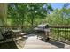 Enjoy outdoor dining on this spacious wood deck with a grill at 1214 Marshall Fuller Rd, Dallas, GA 30157