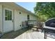 Outdoor wood deck features a grill and dining area, perfect for entertaining at 1214 Marshall Fuller Rd, Dallas, GA 30157