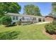 Quaint white brick home with a charming front porch, perfect for relaxing outdoors at 1214 Marshall Fuller Rd, Dallas, GA 30157