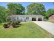 Inviting single-story home with a long driveway and an attached 2 car garage at 1214 Marshall Fuller Rd, Dallas, GA 30157