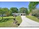 Charming single-story home with a well-manicured lawn, mature trees, and an extra long driveway at 1214 Marshall Fuller Rd, Dallas, GA 30157