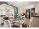 Open kitchen with a dining area, stainless steel refrigerator, and easy access to the living room at 1214 Marshall Fuller Rd, Dallas, GA 30157