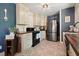 Modern kitchen with stainless steel appliances, dark countertops, and decorative fork and spoon art at 1214 Marshall Fuller Rd, Dallas, GA 30157
