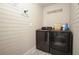 Laundry room with black appliances, white walls and Laundry Co sign at 1214 Marshall Fuller Rd, Dallas, GA 30157