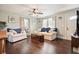 Cozy living room with hardwood floors, neutral walls, and a decorative ceiling fan at 1214 Marshall Fuller Rd, Dallas, GA 30157