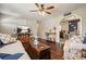 Bright living room with hardwood floors, stylish decor, and archway to the kitchen at 1214 Marshall Fuller Rd, Dallas, GA 30157