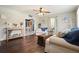 Inviting living room features hardwood floors, neutral paint, and lots of natural light at 1214 Marshall Fuller Rd, Dallas, GA 30157
