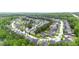An aerial view of the real estate development with lush greenery surrounding homes in a circular design at 256 Bollen Ln, Hiram, GA 30141