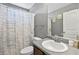 Bright bathroom featuring a shower/tub combo, and a vanity that offers storage and style at 256 Bollen Ln, Hiram, GA 30141