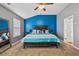 Cozy bedroom with a blue accent wall, carpet, and well lit with natural light at 256 Bollen Ln, Hiram, GA 30141