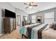 Main bedroom featuring carpet, dresser, and mirror with natural lighting from windows at 256 Bollen Ln, Hiram, GA 30141