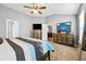 Carpeted main bedroom with vaulted ceiling, a dresser, and a large mirror near a door at 256 Bollen Ln, Hiram, GA 30141