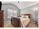 Bedroom featuring a bed, neutral walls, and a window creating a cozy and inviting retreat at 256 Bollen Ln, Hiram, GA 30141