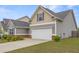 Charming two-story home with gray siding, well-kept lawn, and a spacious two-car garage, perfect for families at 256 Bollen Ln, Hiram, GA 30141