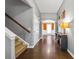 Spacious hallway with dark wood floors, a staircase, and elegant gray walls for a welcoming entrance at 256 Bollen Ln, Hiram, GA 30141