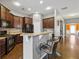 Kitchen featuring bar seating, granite countertops, and easy access to the dining area at 256 Bollen Ln, Hiram, GA 30141