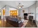 Open-concept living room featuring hardwood floors, fireplace, and view into the dining area at 256 Bollen Ln, Hiram, GA 30141