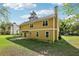 A spacious backyard with a concrete patio is surrounded by lush green grass at 3479 Portsmouth Cir, Lithonia, GA 30038