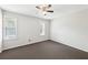 Bedroom featuring neutral walls, two large windows and modern ceiling fan at 3479 Portsmouth Cir, Lithonia, GA 30038