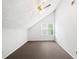 An attic bedroom featuring a window and ceiling fan at 3479 Portsmouth Cir, Lithonia, GA 30038