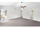 Bedroom featuring vaulted ceiling, fan, private patio door, and bathroom access at 3479 Portsmouth Cir, Lithonia, GA 30038