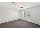 Bedroom with neutral walls, large window and ceiling fan at 3479 Portsmouth Cir, Lithonia, GA 30038