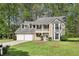 Charming two-story home featuring a welcoming front porch and well-manicured lawn at 3479 Portsmouth Cir, Lithonia, GA 30038