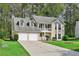 Charming two-story home featuring a welcoming front porch and well-manicured lawn at 3479 Portsmouth Cir, Lithonia, GA 30038