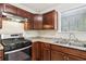 Kitchen featuring stainless steel appliances, granite countertops, and wood cabinets at 3479 Portsmouth Cir, Lithonia, GA 30038