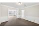 Cozy living room featuring chair rail and an open view of the sunroom at 3479 Portsmouth Cir, Lithonia, GA 30038