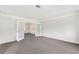 Inviting living room features carpet flooring and charming glass paneled french doors at 3479 Portsmouth Cir, Lithonia, GA 30038