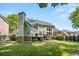 View of the back exterior showcasing a green lawn, a deck, and siding, providing an inviting outdoor space at 4862 Tarry Post Ln, Suwanee, GA 30024