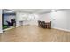 Finished basement featuring a dining area and golf simulator for indoor entertainment and leisure at 4862 Tarry Post Ln, Suwanee, GA 30024