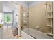Bathroom with glass shower door, tile surround, and an entrance to a bedroom at 4862 Tarry Post Ln, Suwanee, GA 30024
