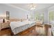 Bedroom with two beds, hardwood floors, and large windows providing lots of natural light at 4862 Tarry Post Ln, Suwanee, GA 30024