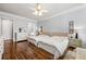 Spacious bedroom with two beds, hardwood floors, and lots of natural light at 4862 Tarry Post Ln, Suwanee, GA 30024