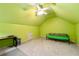 Large bonus room featuring sloped ceilings, carpet flooring and modern lighting at 4862 Tarry Post Ln, Suwanee, GA 30024