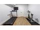 Finished exercise room features a treadmill, stationary bike and a mounted TV at 4862 Tarry Post Ln, Suwanee, GA 30024