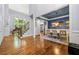 Elegant foyer with hardwood floors, staircase, large windows, and an adjacent formal dining room at 4862 Tarry Post Ln, Suwanee, GA 30024