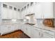 Modern kitchen with white cabinets, granite countertops, and stainless steel appliances at 4862 Tarry Post Ln, Suwanee, GA 30024