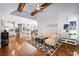 Open concept living room with vaulted ceilings, fireplace, hardwood floors, kitchen and dining at 4862 Tarry Post Ln, Suwanee, GA 30024