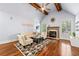 Inviting living room with vaulted ceilings, fireplace, hardwood floors, and comfortable seating arrangement at 4862 Tarry Post Ln, Suwanee, GA 30024