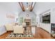 Cozy living room with vaulted ceilings, fireplace, hardwood floors, and comfortable seating at 4862 Tarry Post Ln, Suwanee, GA 30024