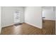 Versatile room with wooden floors, leading to a ping pong area at 4862 Tarry Post Ln, Suwanee, GA 30024