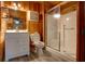 Cozy bathroom featuring updated vanity, and a shower with sliding glass doors at 5520 Hearn Rd, Ellenwood, GA 30294