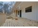 Spacious front porch with a wooden deck, providing an inviting outdoor area and entry to the home at 5520 Hearn Rd, Ellenwood, GA 30294